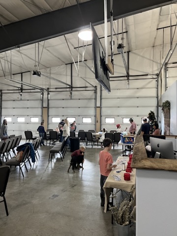 Members of Gallatin River Fellowship gathered in conversation in the fellowship hall after a Sunday service