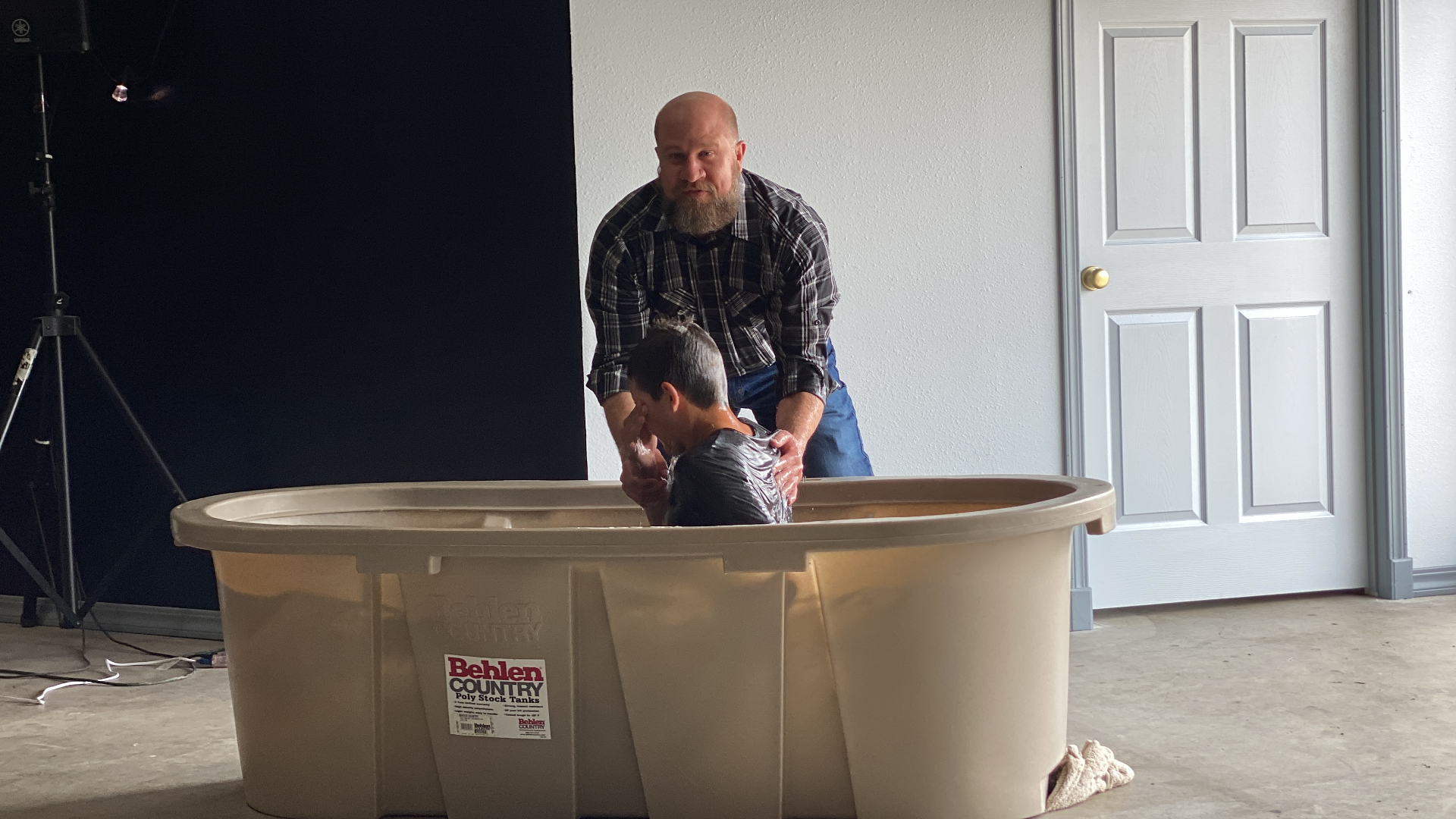 A new believer being baptized by a pastor at Gallatin River Fellowship